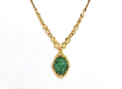 Gold necklace with carved Emerald